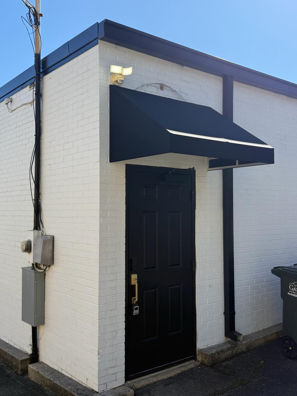 Canvas door awning on storefront in Gastonia