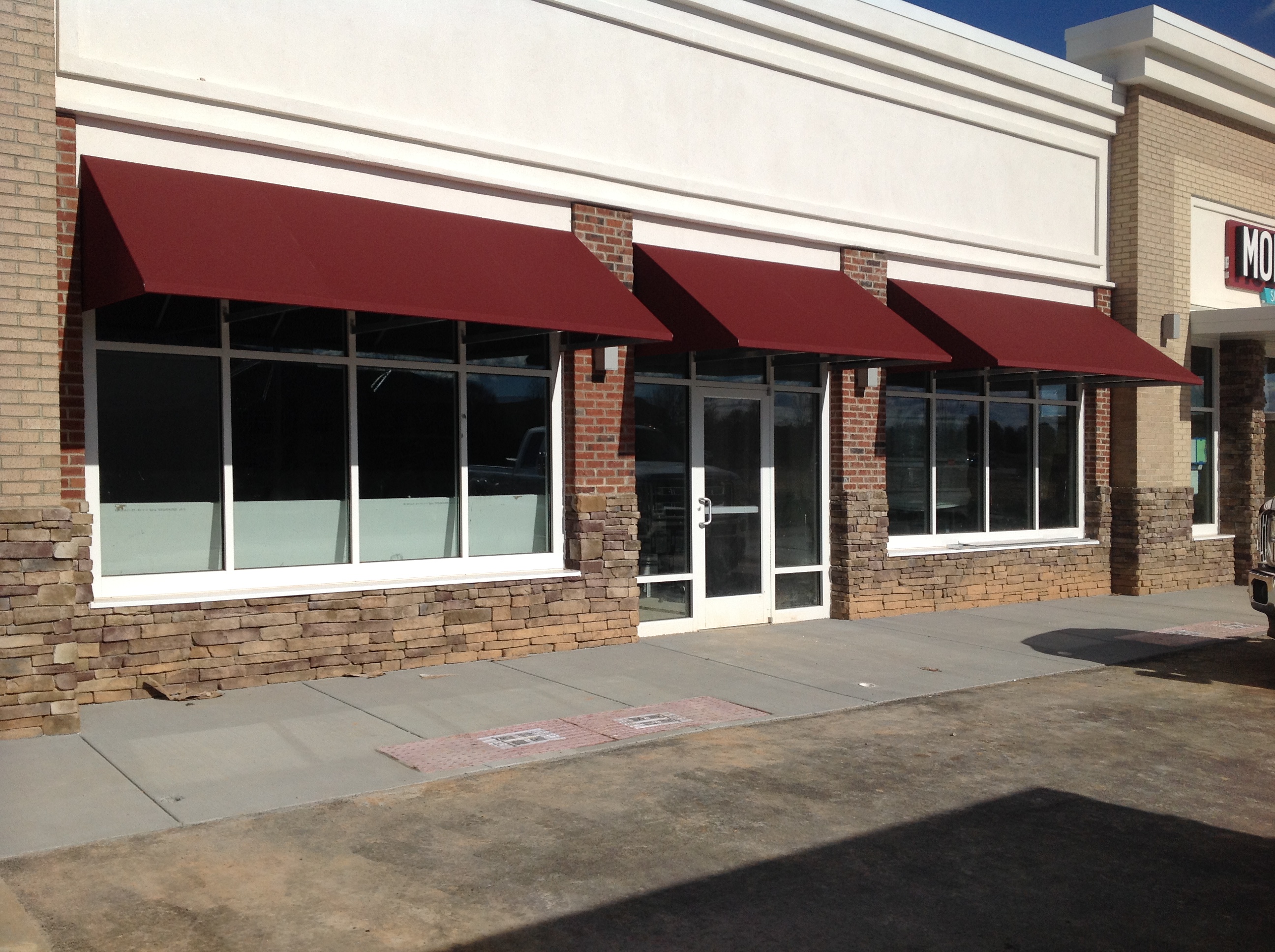 Storefront concave awning in Morganton